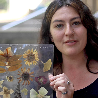 Student holding pressed flowers