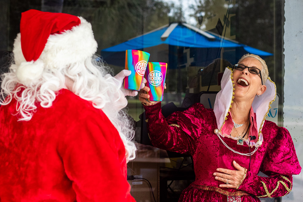 Lova dressed in medieval garb shares a laugh with Santa Claus