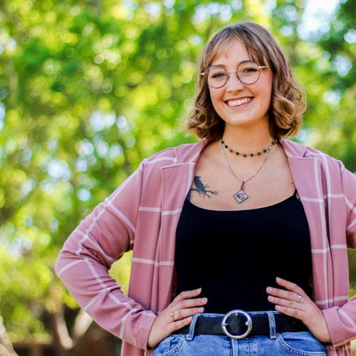 Eckerd student with hands on hips