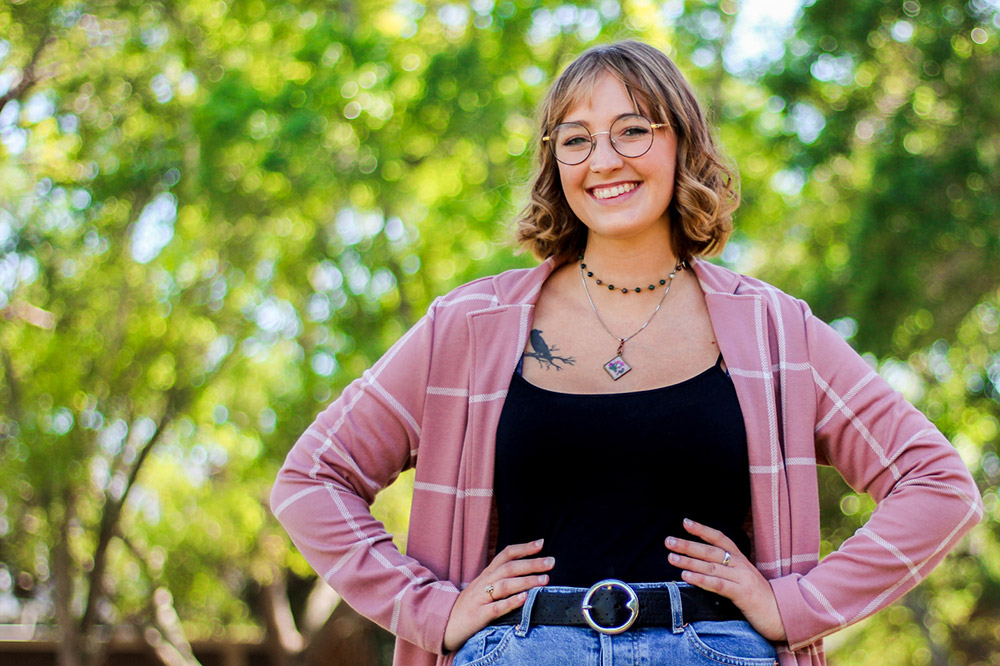 Eckerd student with hands on hips