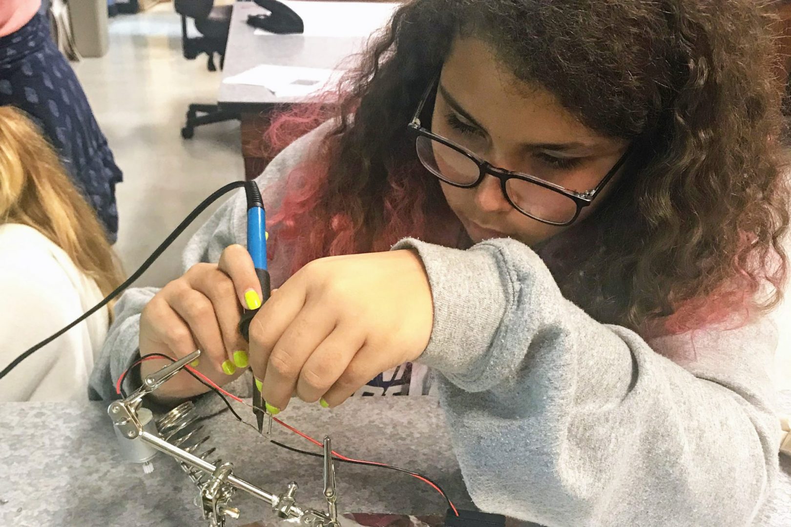 Middle school student soldering