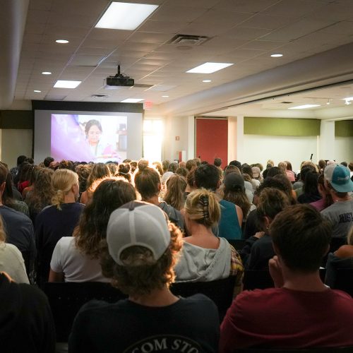 Big crowd listens to author speak in hall