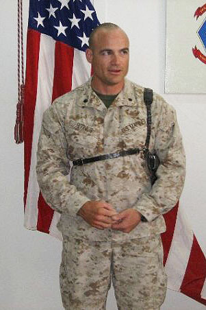 Marine standing in front of American flag