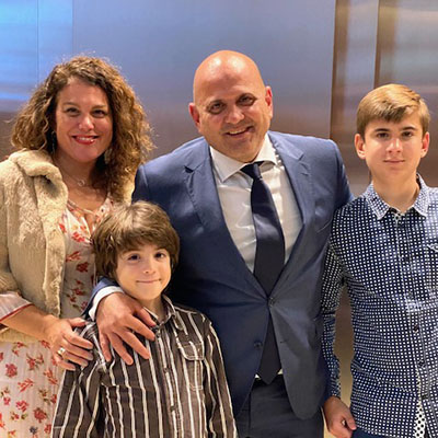 Family of four in formal attire