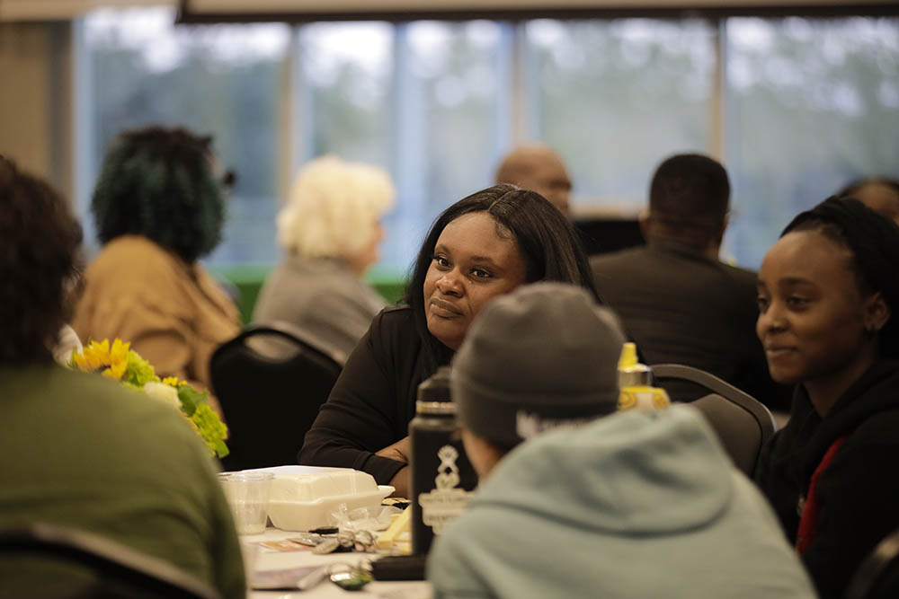 Women in conversation at a round table
