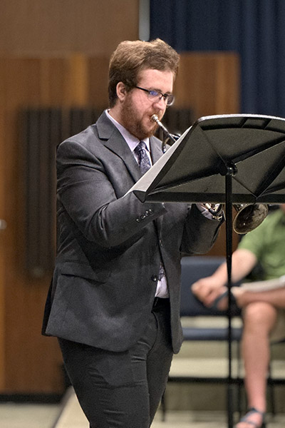 Young trumpeter plays his instrument