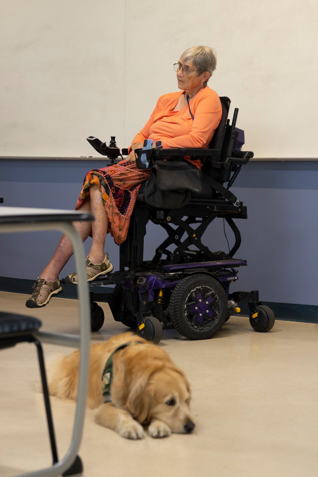 Nancy Janus and her service dog, Fajita sit in an Eckerd College classroom.