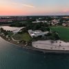 Aerial view of campus with sunset in background