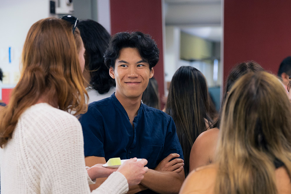 Students chat in a hall