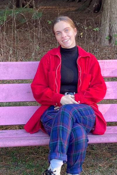 Student seated on bench