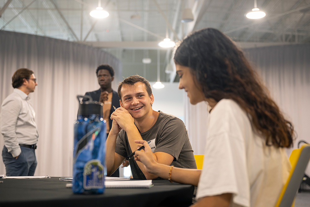 Students chatting at a table