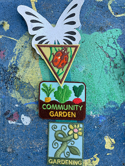 Badges that say "Community garden" and "Gardening"