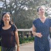Two women walking across campus together in conversation