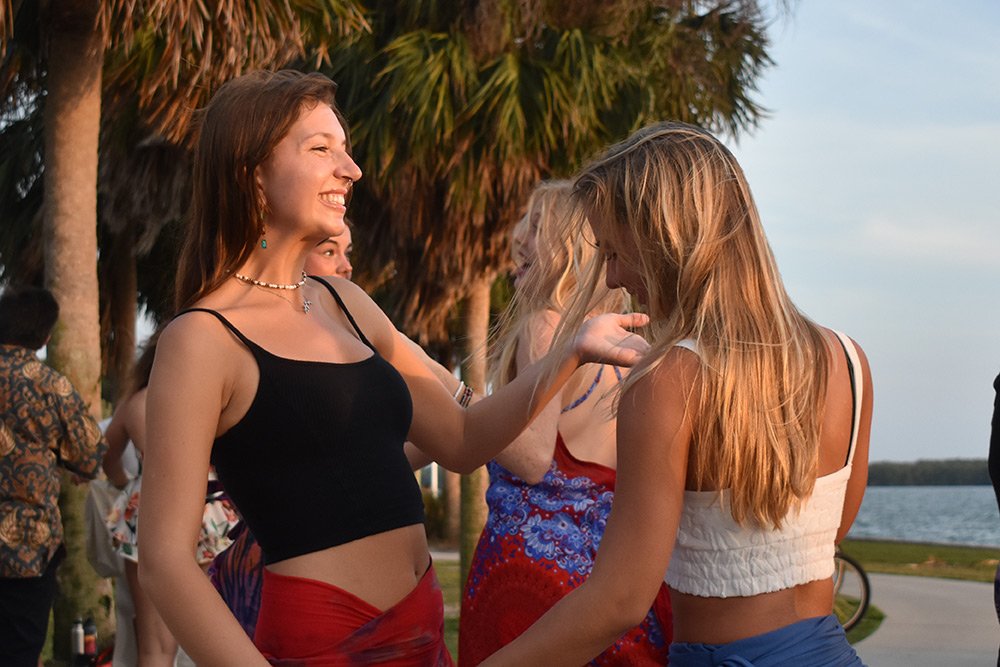 Student smiles as she dances