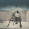 Portrait painting of man sitting next to a skeleton seated in foldable chair