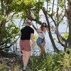 Eckerd students pick up trash in the mangroves.