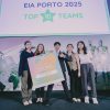 Students pose with Top 10 finisher sign at EIA