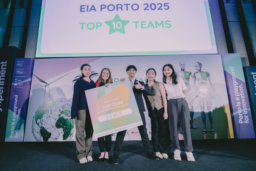 Students pose with Top 10 finisher sign at EIA