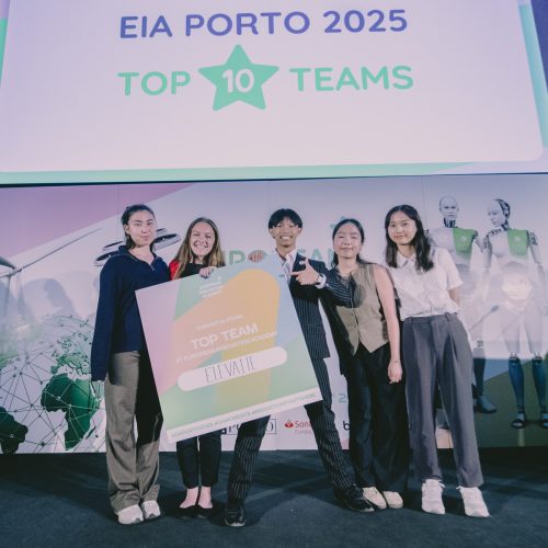 Students pose with Top 10 finisher sign at EIA