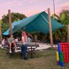 Students playing games and dancing at the Eckerd College Community Farm.