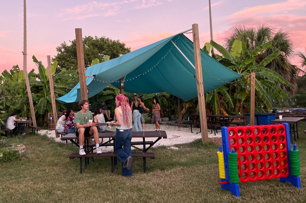 Students playing games and dancing at the Eckerd College Community Farm.