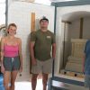 Three students stand side by side a professor with a clean kiln behind them
