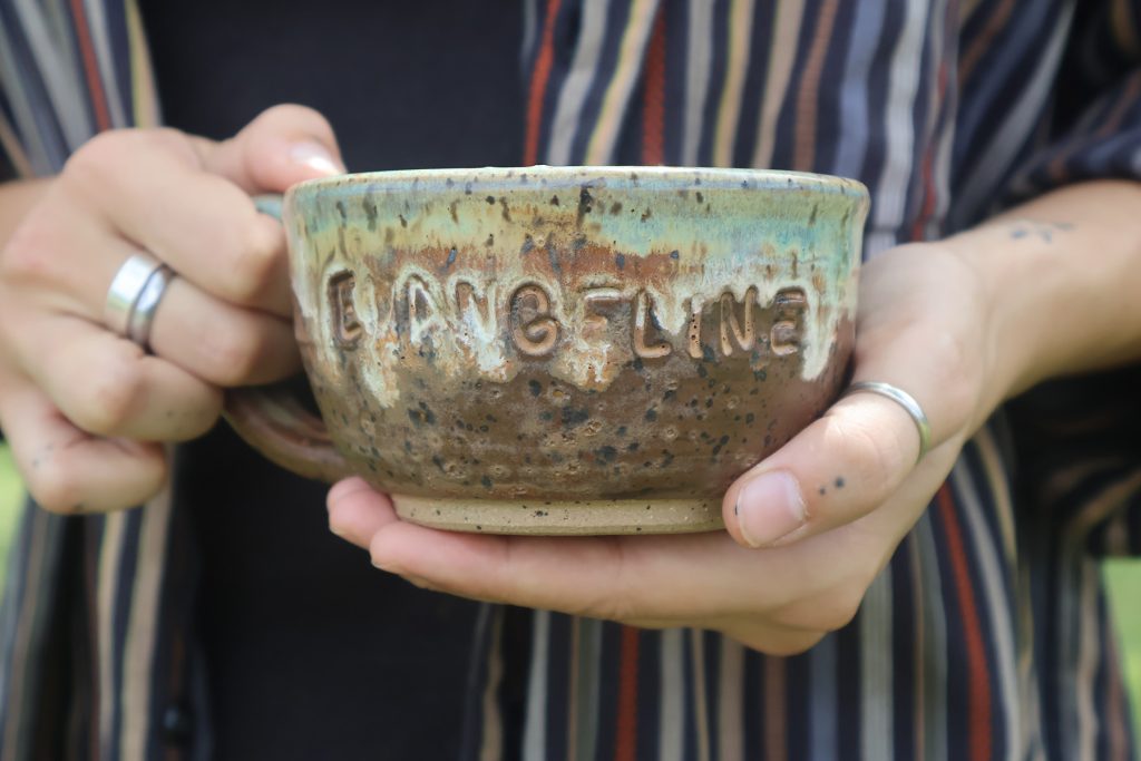 Pottery bowl with text EVANGELINE on the side