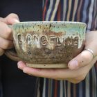 Pottery bowl with text EVANGELINE on the side