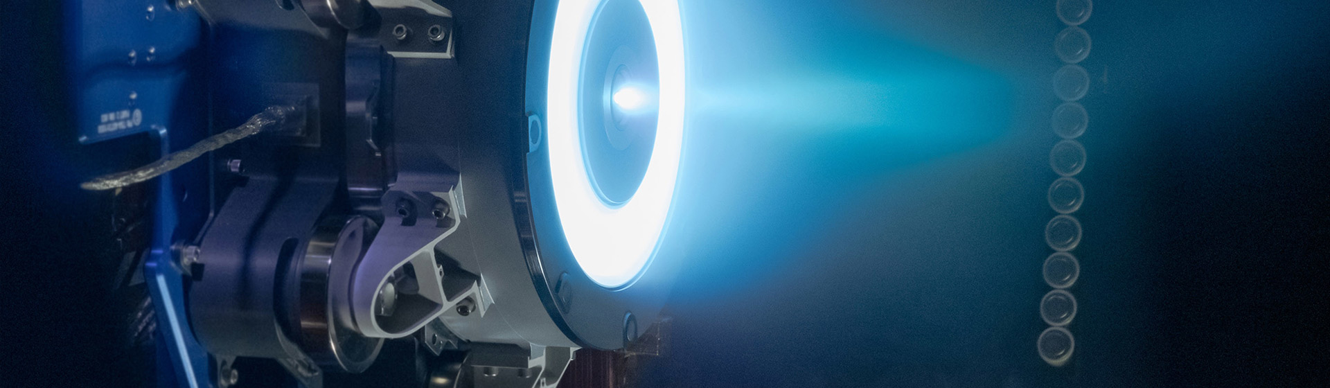 Propulsion thruster with bright white ring and blue light emanating from it