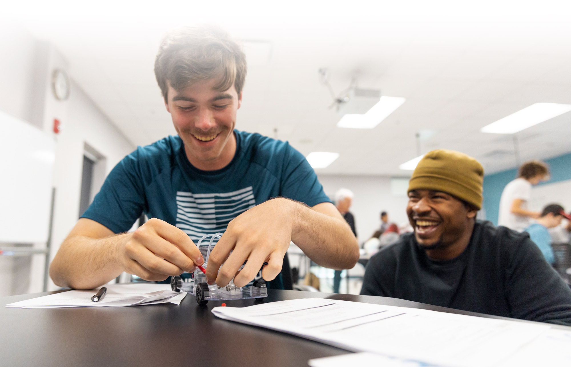 Eckerd College students work with a hydrogen-powered car in a physics class