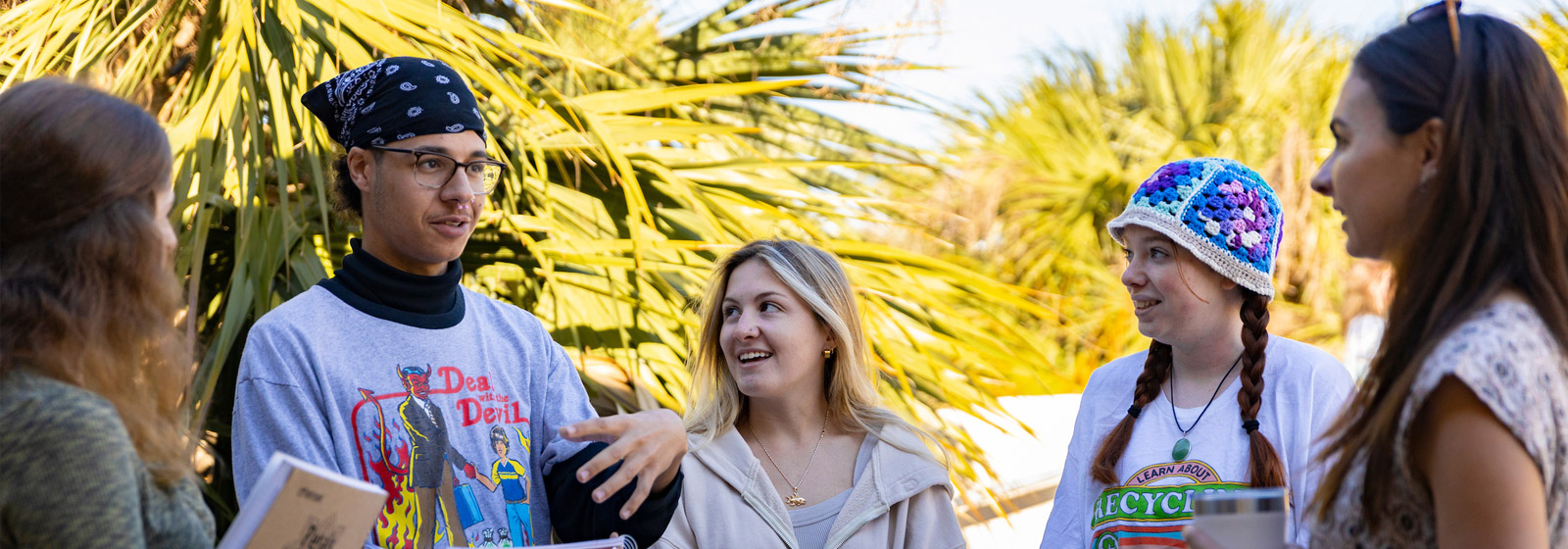 Eckerd College psychology students standing outside and chatting with professor
