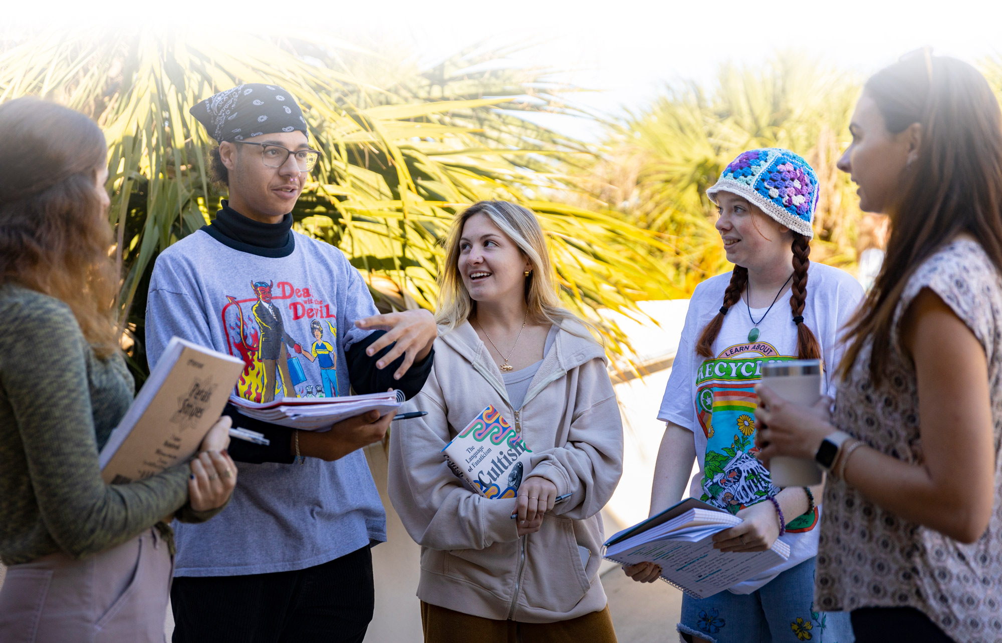 Eckerd College psychology students standing outside and chatting with professor