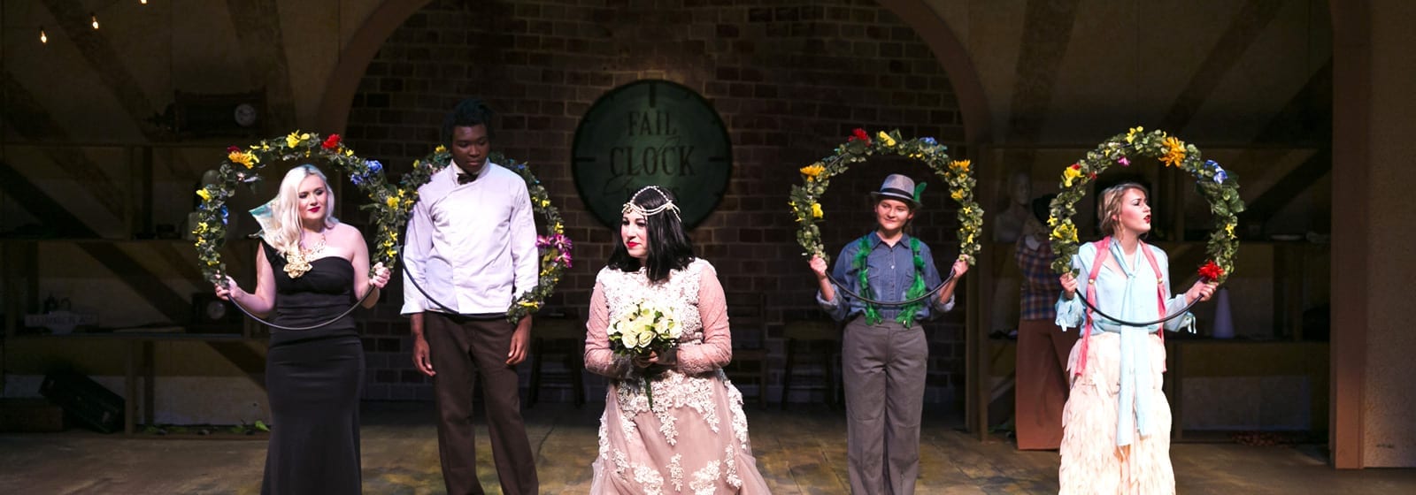 Five theatre students on stage at Eckerd College
