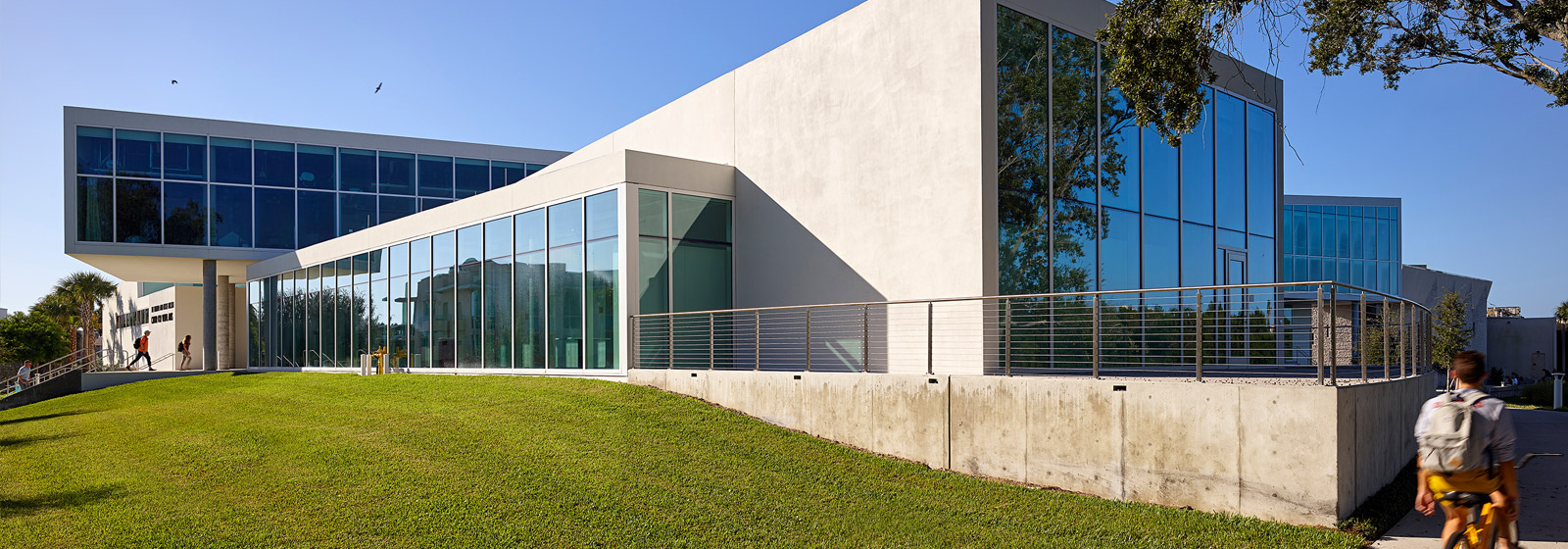 Students walking into modern arts building