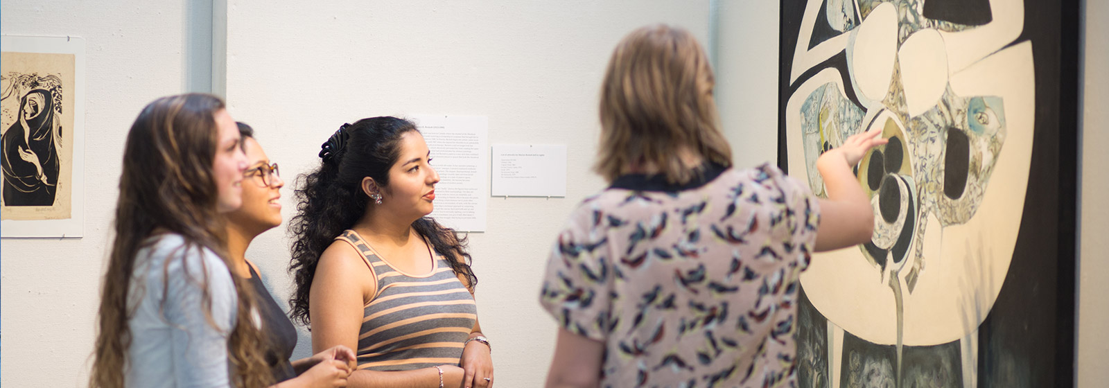 Eckerd visual arts students discussing a piece of art