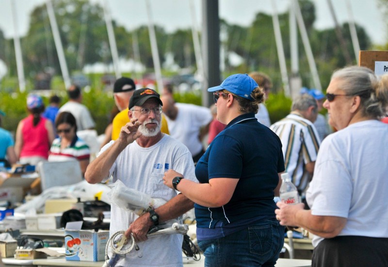 Customer at Annual Marine Yard Sale talking with another customer