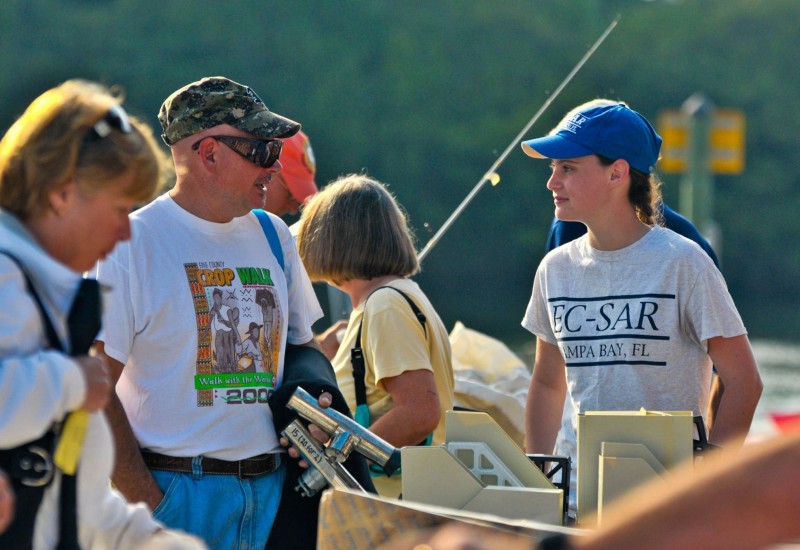 Customer at Annual Marine Yard Sale talking with EC-SAR member