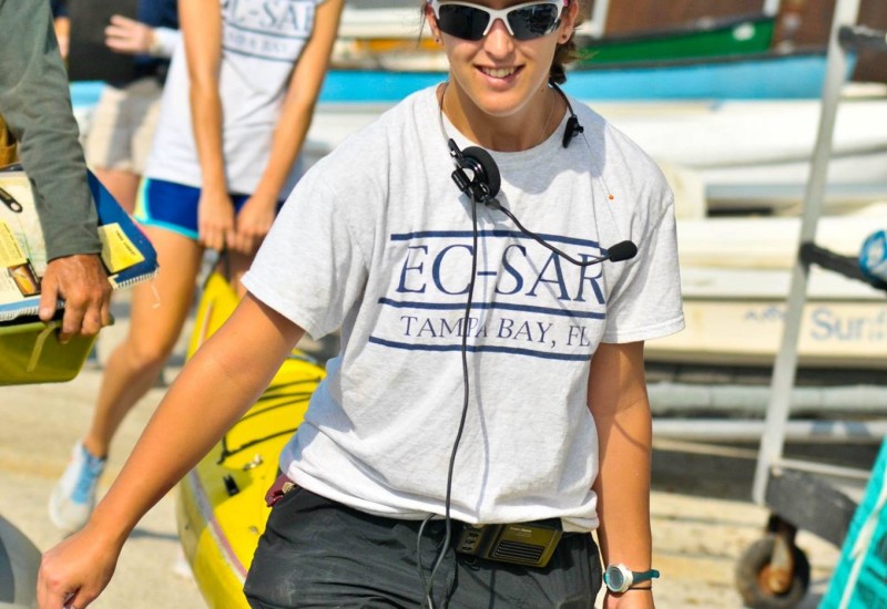 EC-SAR members lift a kayak at the Annual Marine Yard Sale