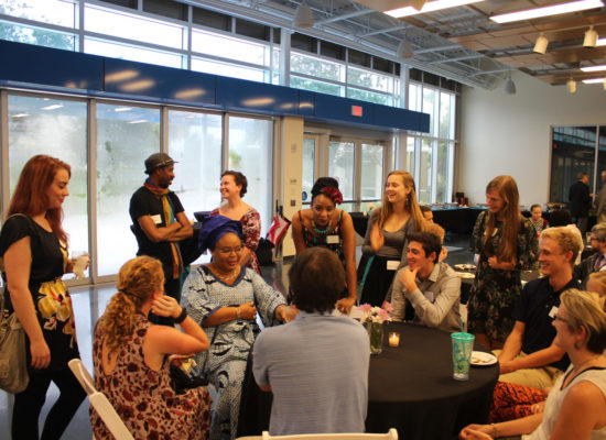 Nobel Peace Prize Laureate Leymah Gbowee speaking with students at dinner in James Center