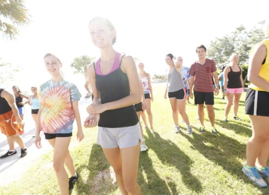 Students participating in group fitness at South Field