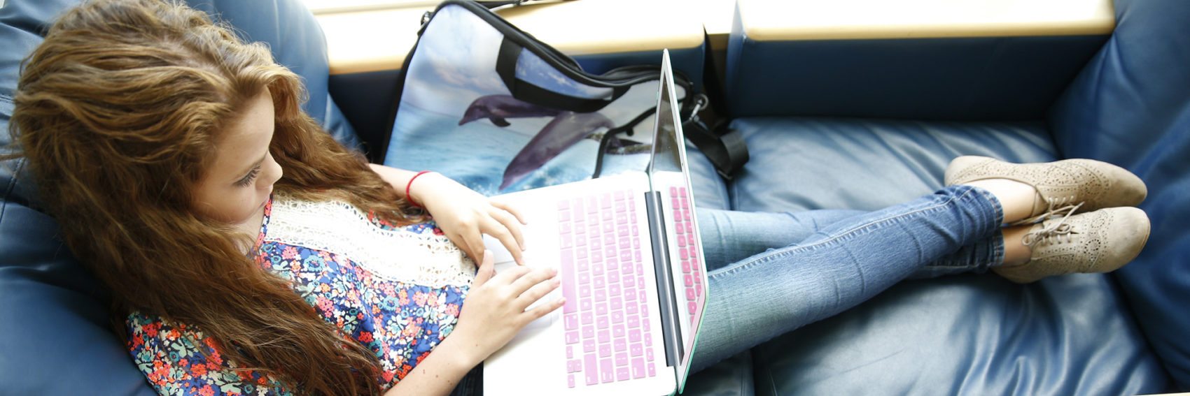 Student on laptop in library