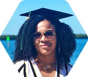 Anjali Boyd wearing graduation cap on South Beach