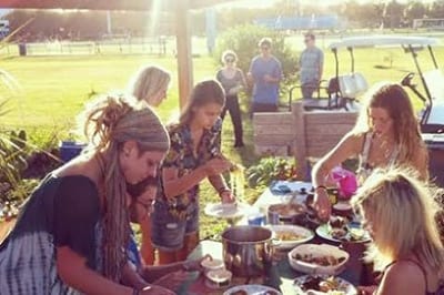 Students sitting down to meal outside