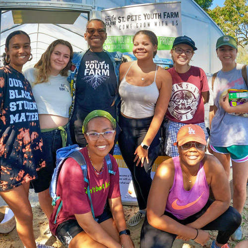 Eckerd College students volunteering at the St. Pete Youth Farm for reflective service learning