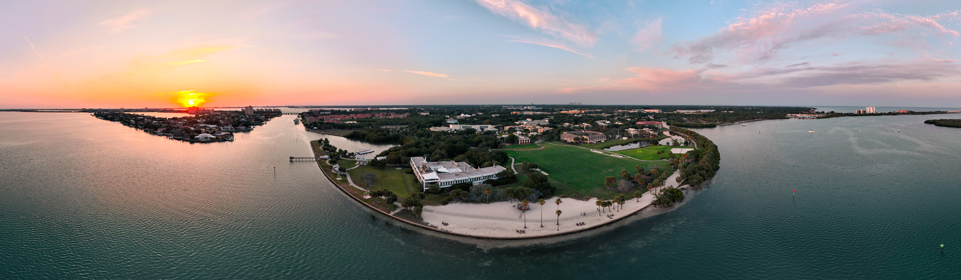Aerial view of sunset behind campus