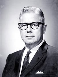 William H. Kadel wearing glasses